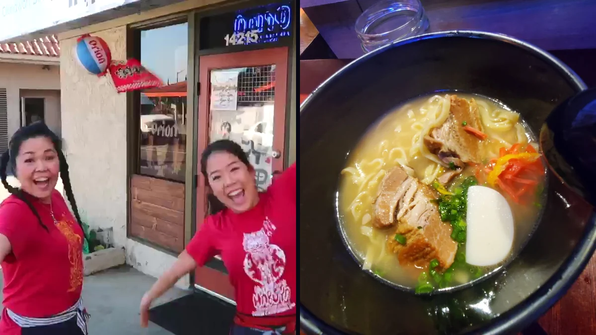 Warm-lit table with ramen and side dishes.