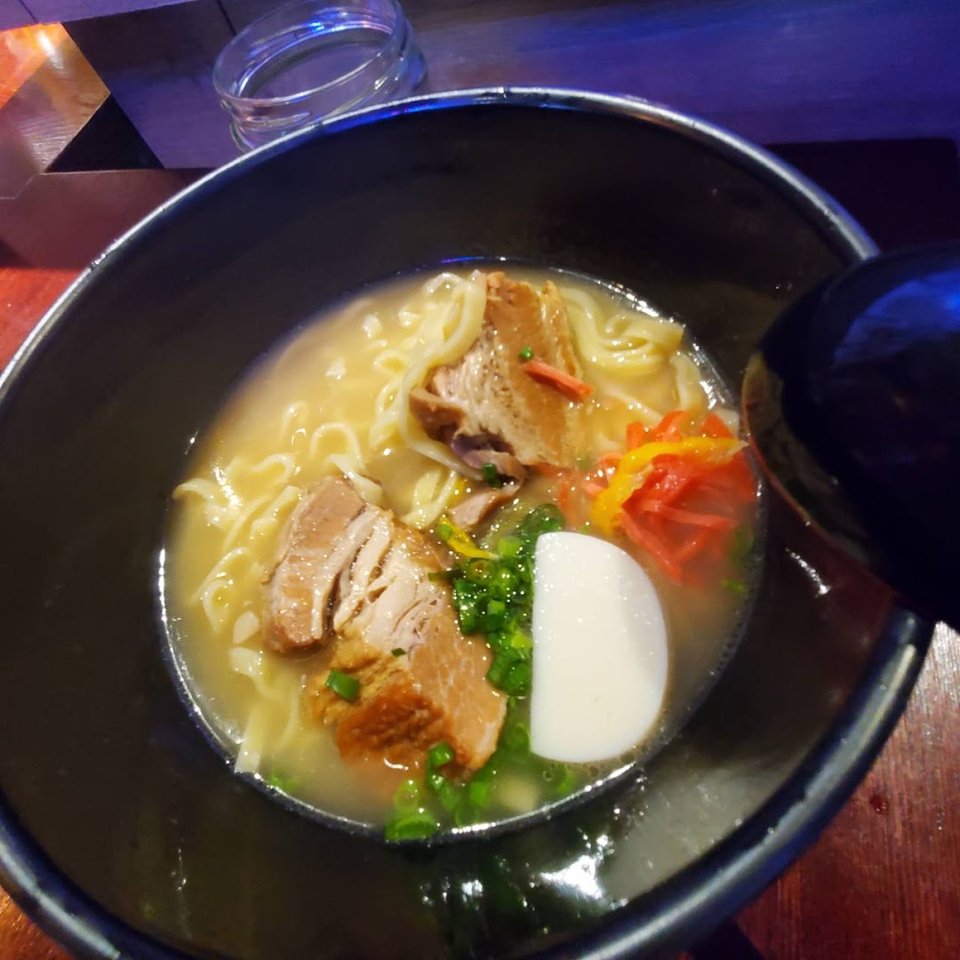 Bowls and small plates in a cozy dining room.